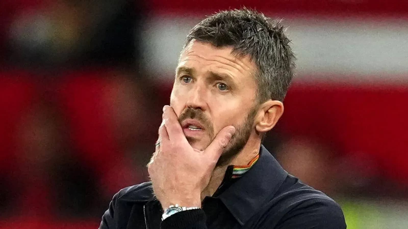 Coach looking thoughtful during a match