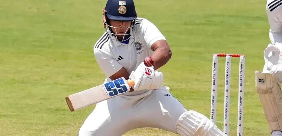 Batsman playing a shot in a cricket match
