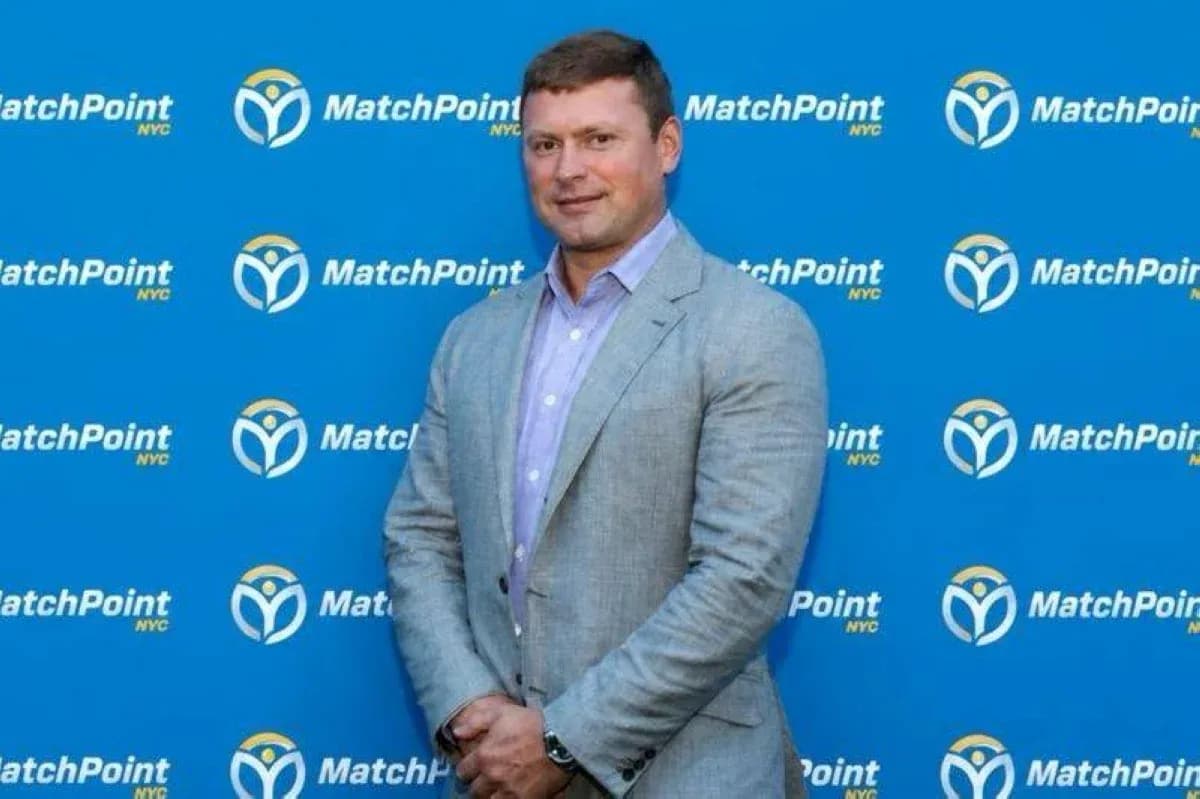 Person posing in front of MatchPoint NYC backdrop