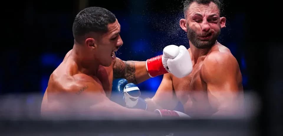 Boxers exchanging punches during a boxing match