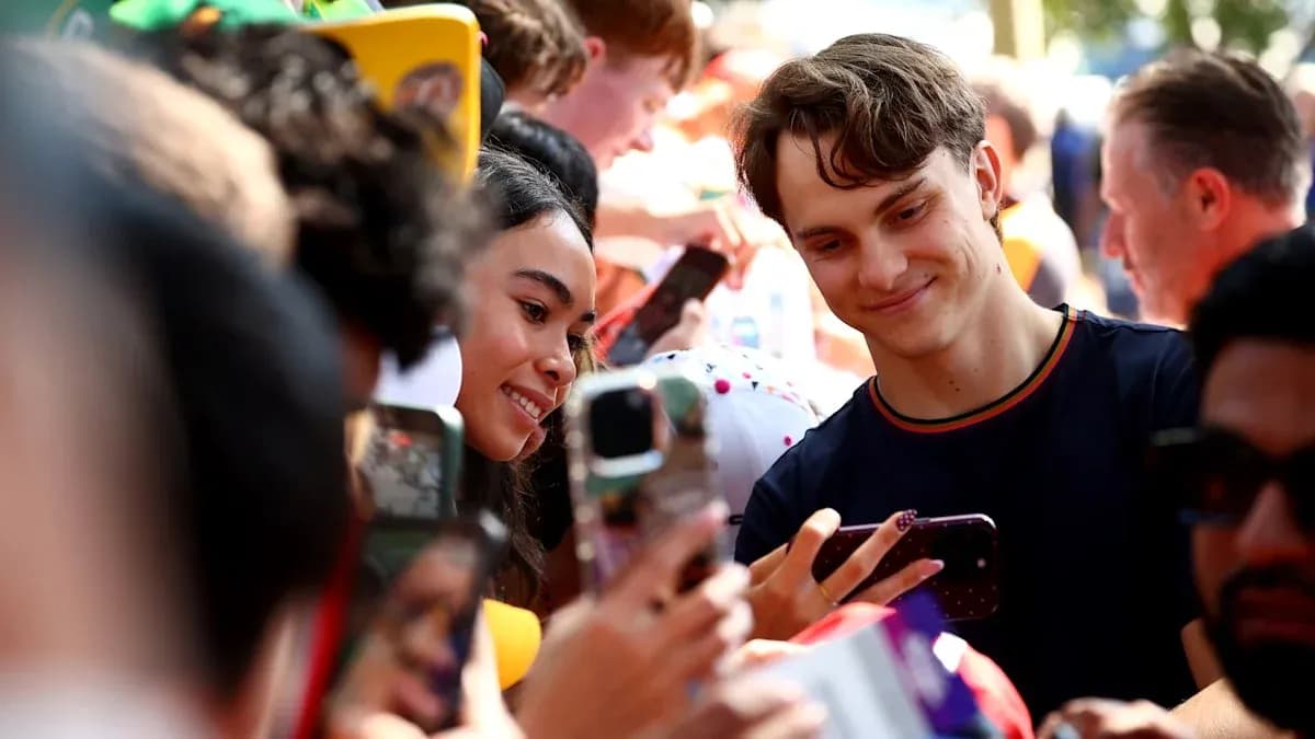 Fans taking selfies at a public event