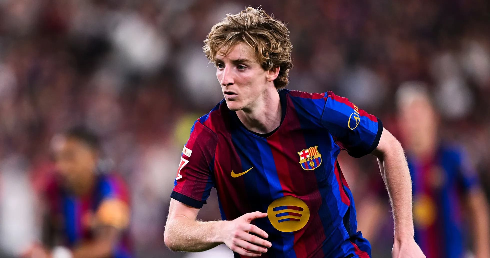 Barcelona player sprinting during a match
