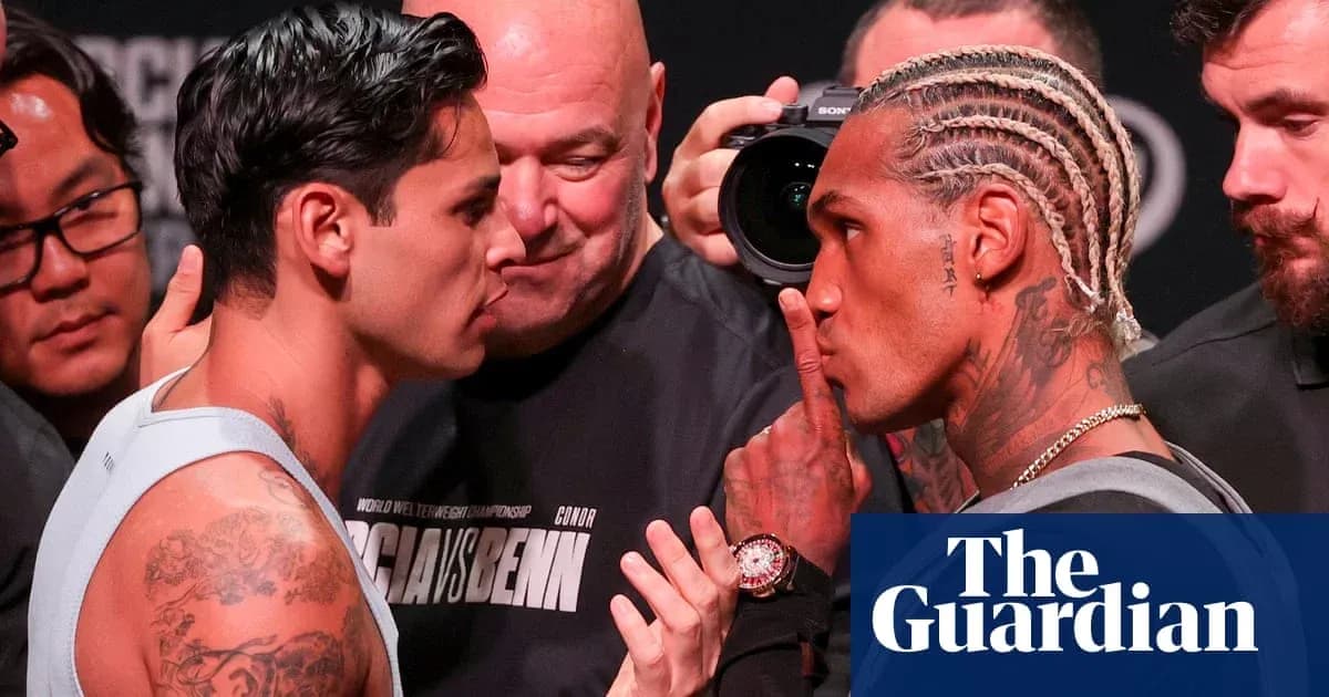 Two boxers face off during weigh-in event
