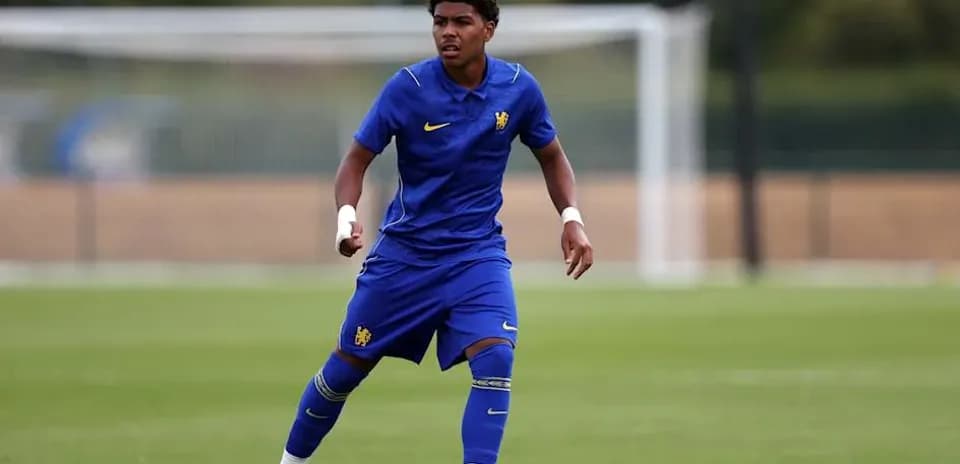 Player in blue kit running on training pitch