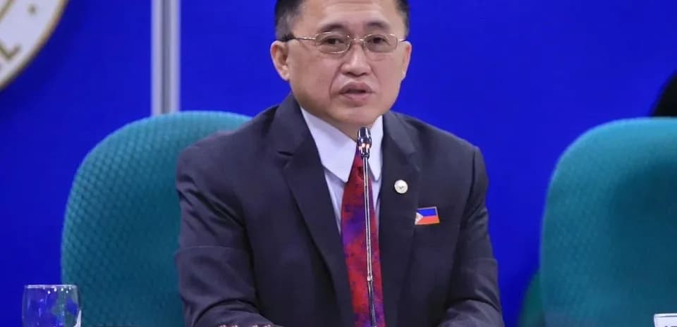 Official speaking at a conference table