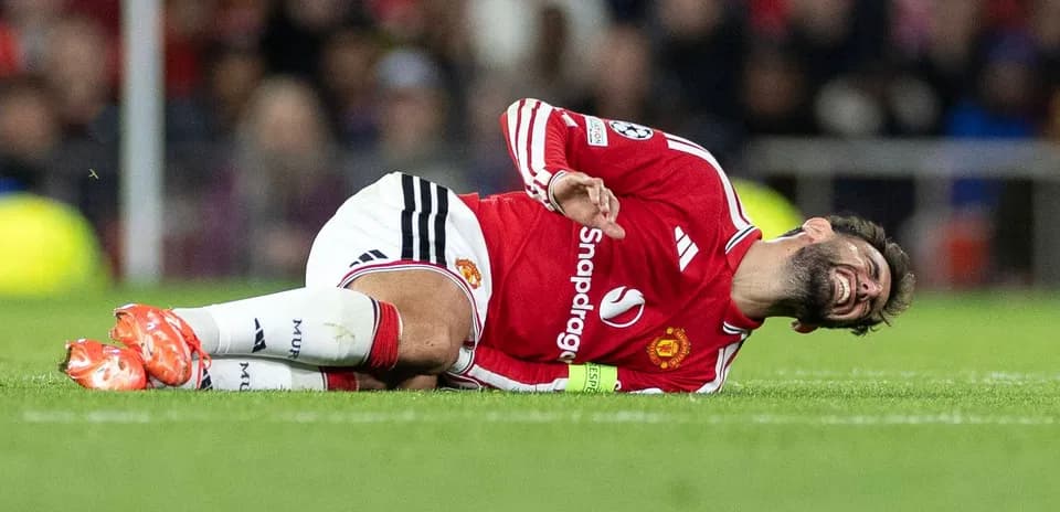 Player lying on pitch after injury during match
