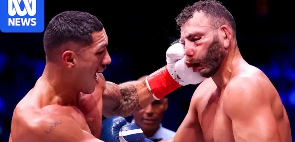 Boxer landing a punch during a match
