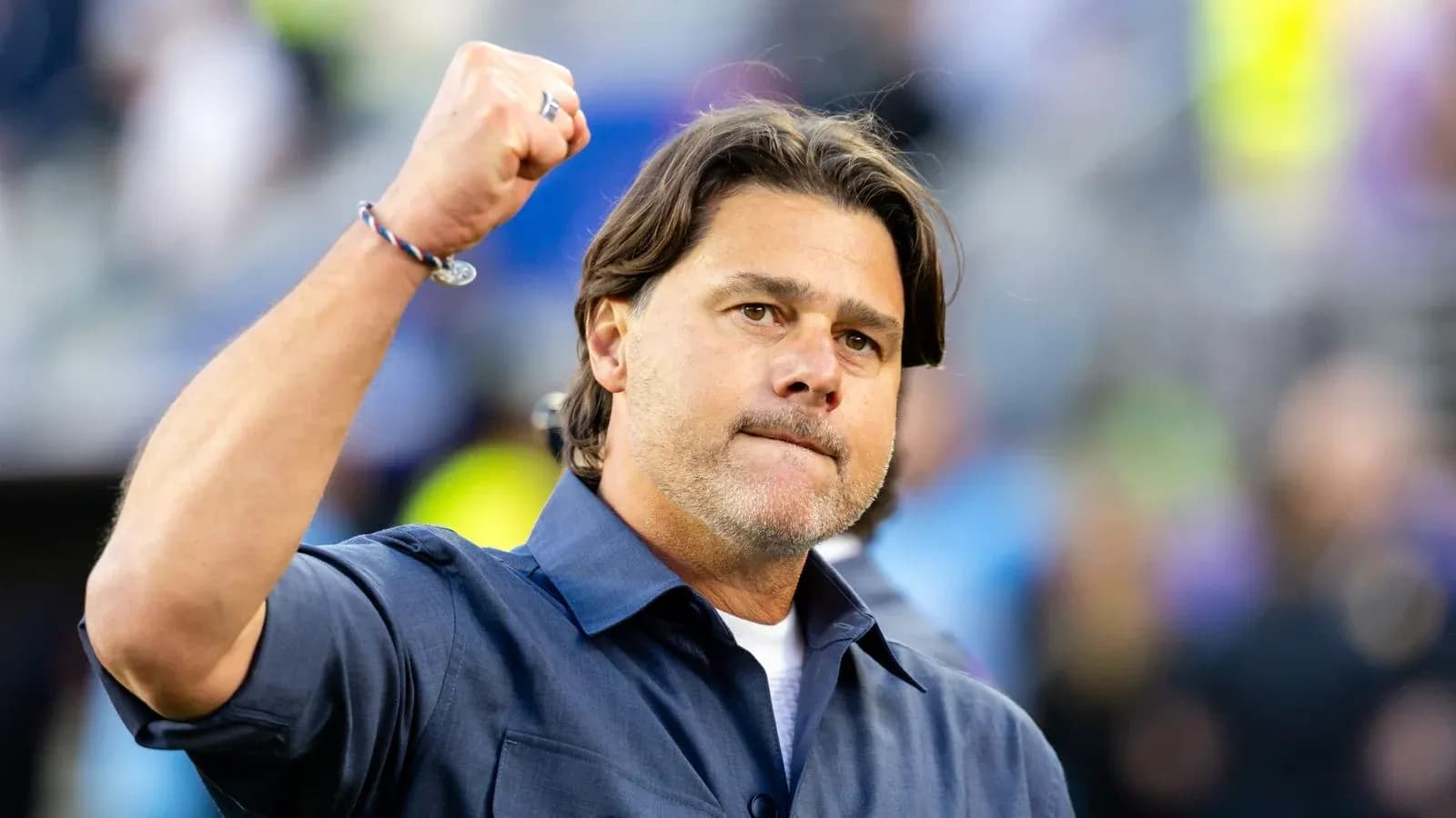 Coach raising fist during game celebration