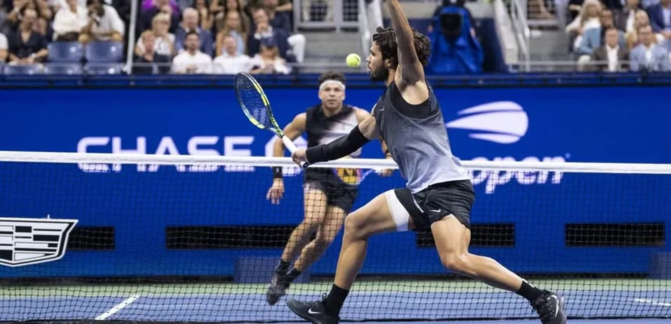 Player hitting a tennis ball during a match