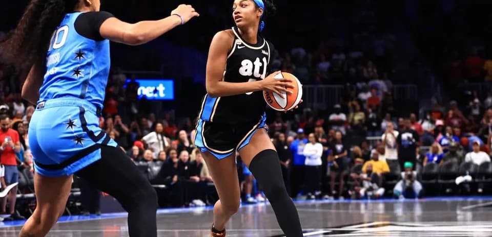 Player dribbling basketball during intense game action