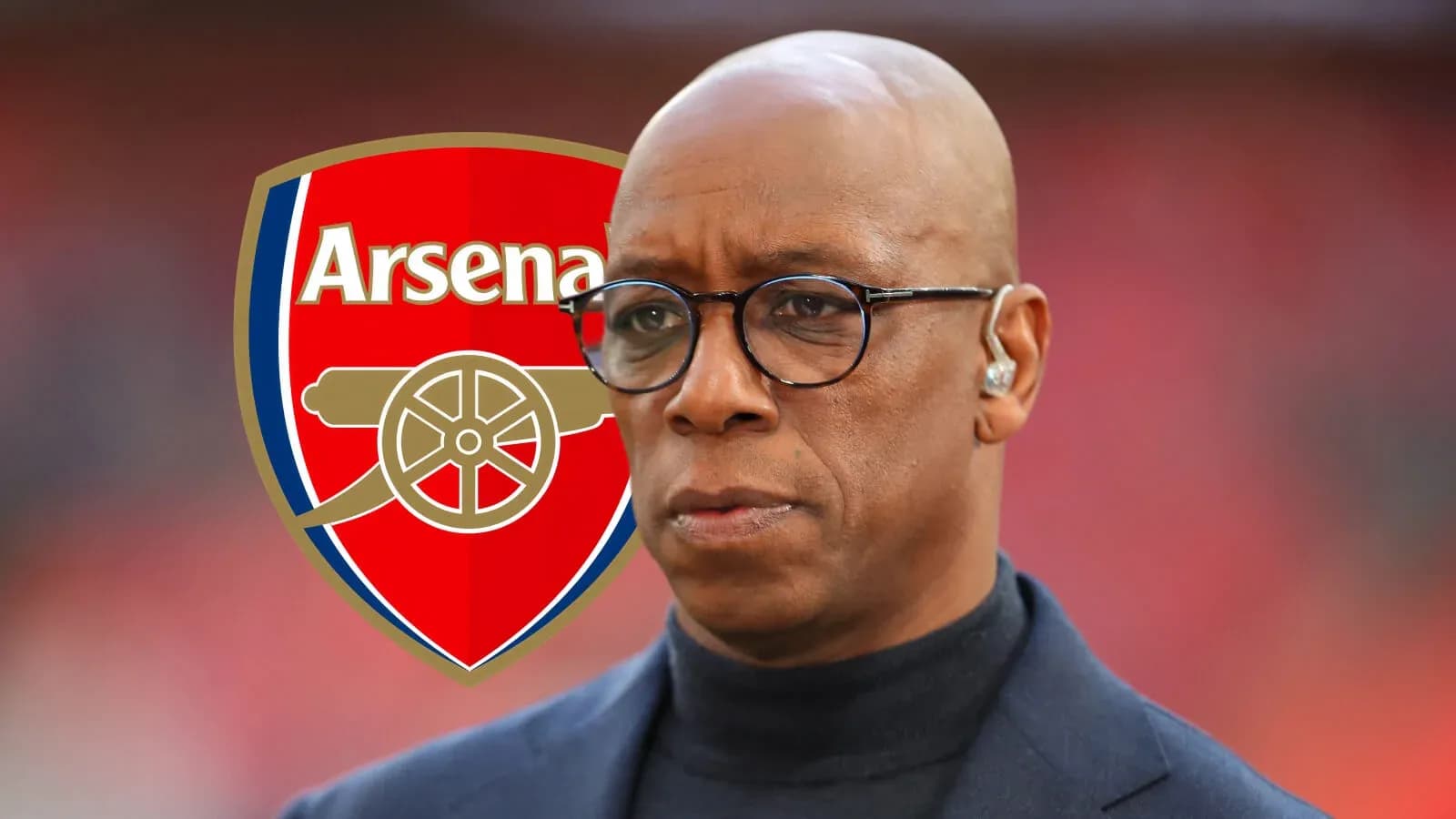Person in front of Arsenal logo during event