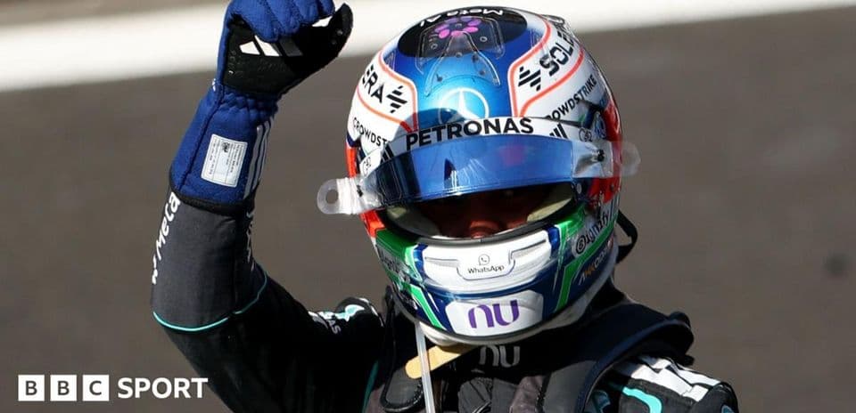 Driver celebrating with fist raised after race