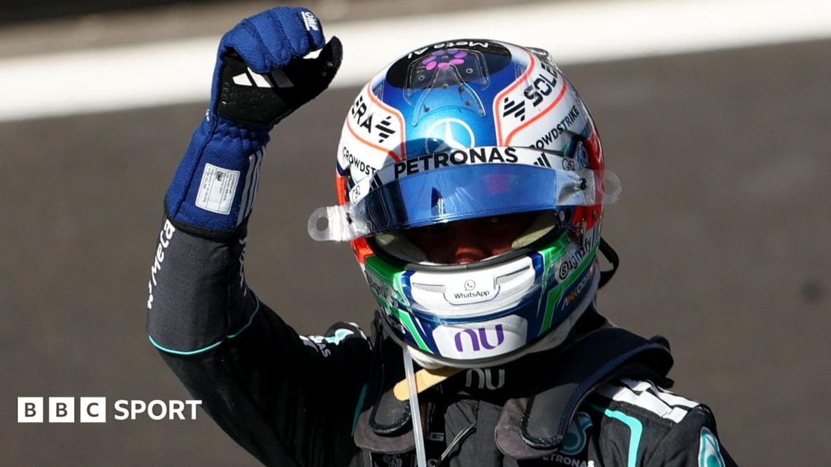 Driver celebrating with fist raised after race