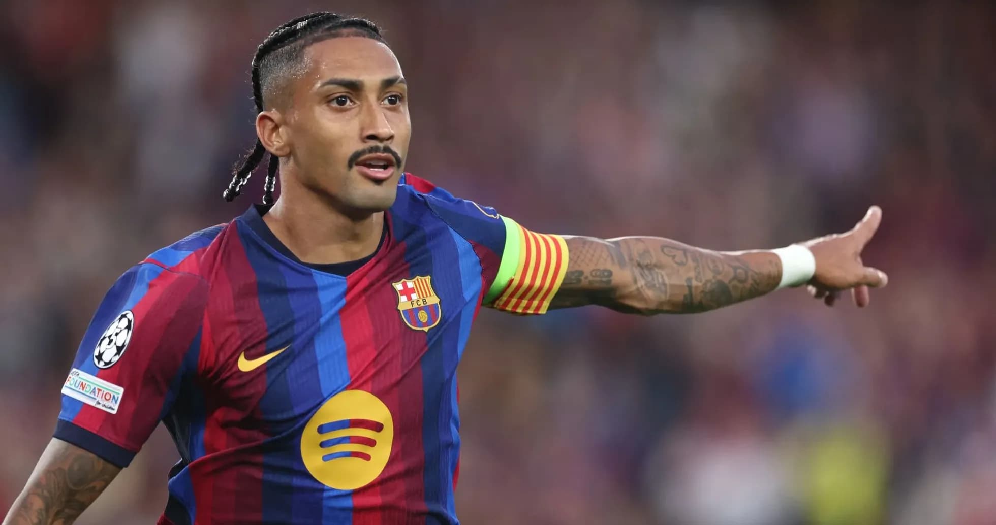 Player gesturing during a UEFA Champions League match