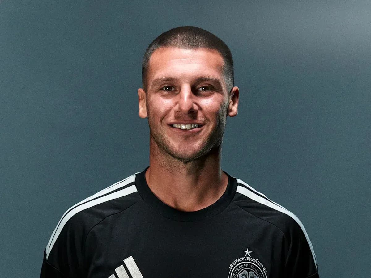 Football player posing in team training kit
