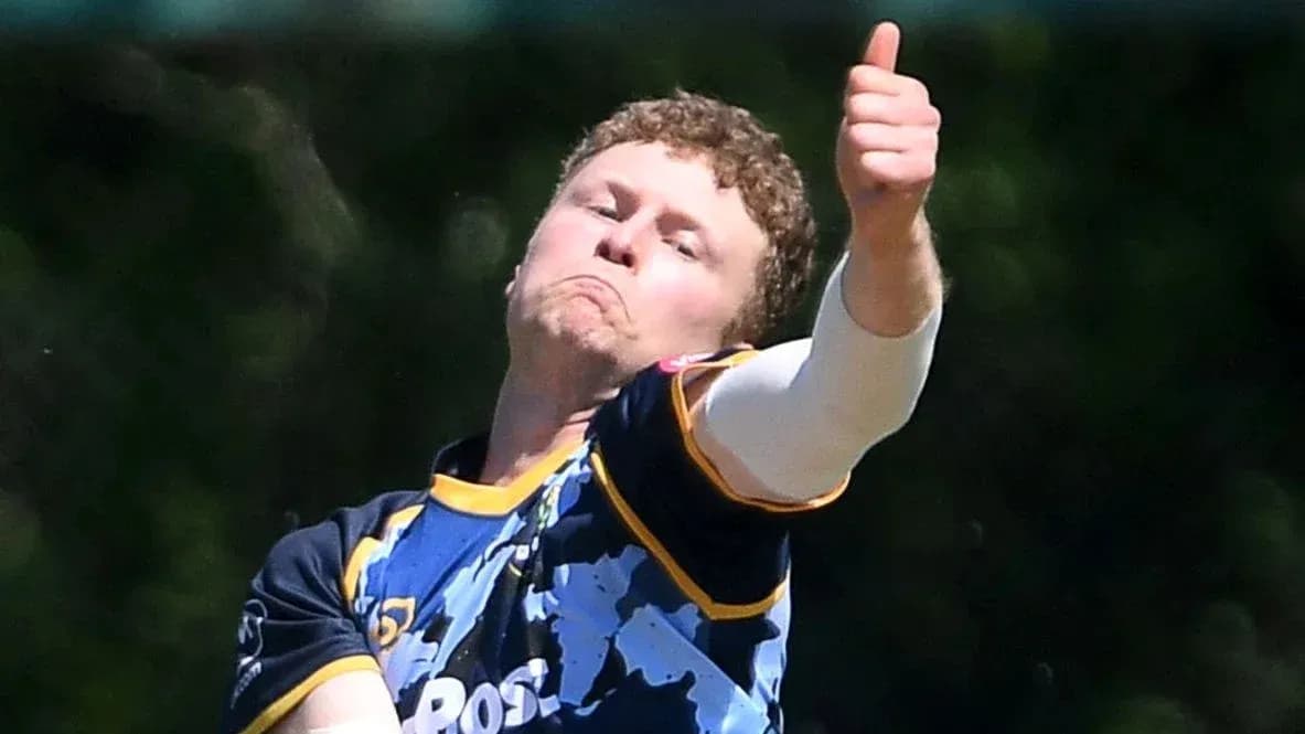 Bowler delivering ball with thumbs up gesture