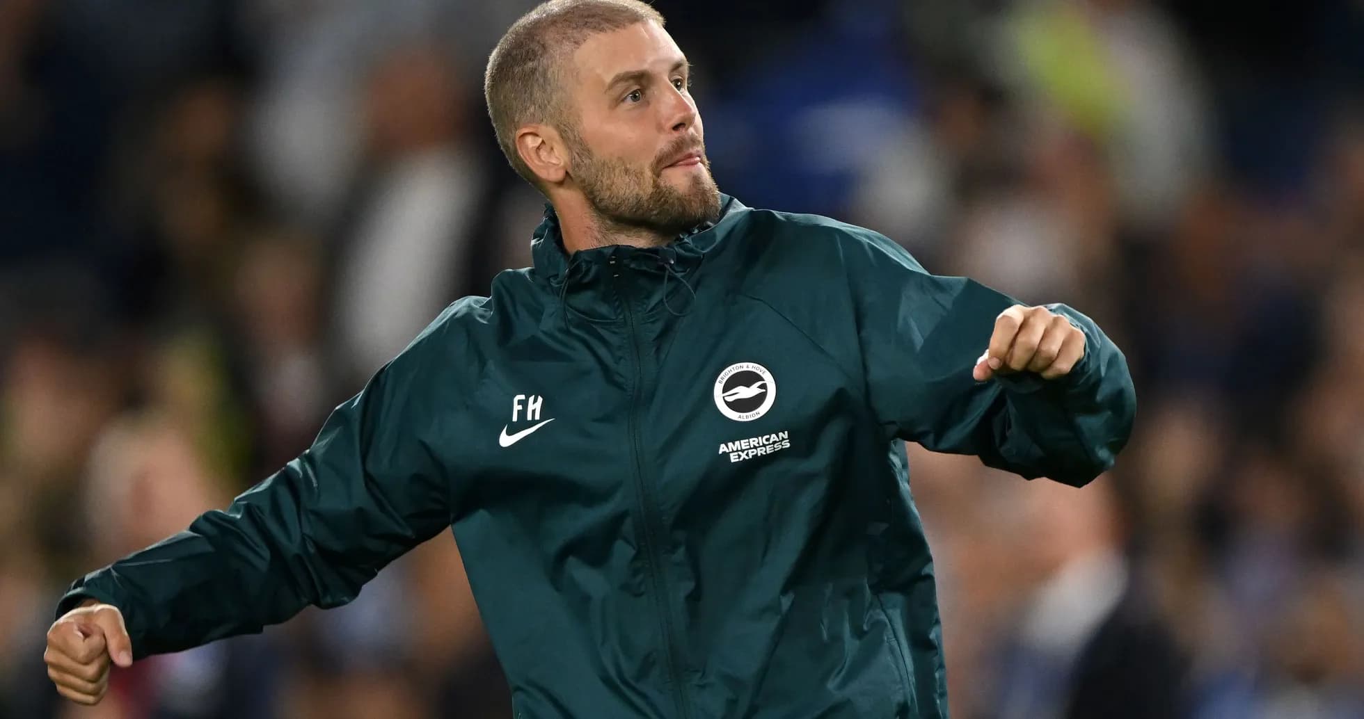 Coach celebrating during a football match