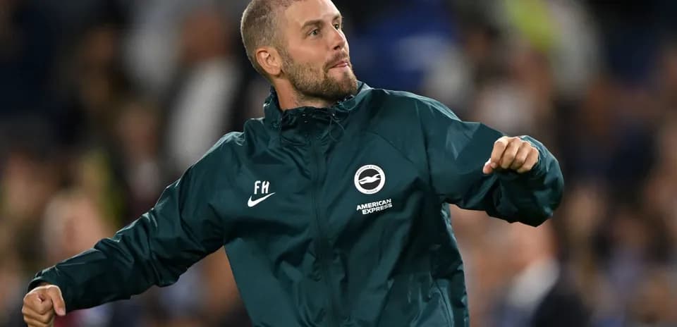 Coach celebrating during a football match