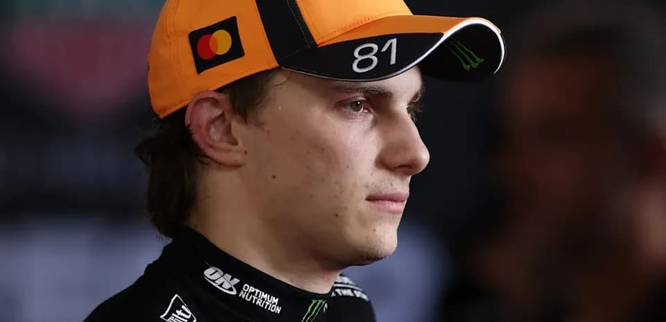 Racing driver wearing cap in interview setting