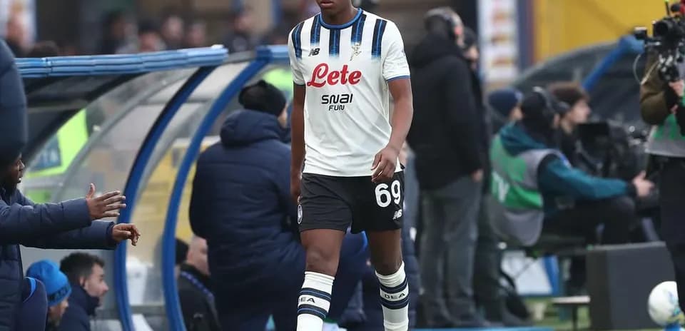 Player walking off the pitch towards bench