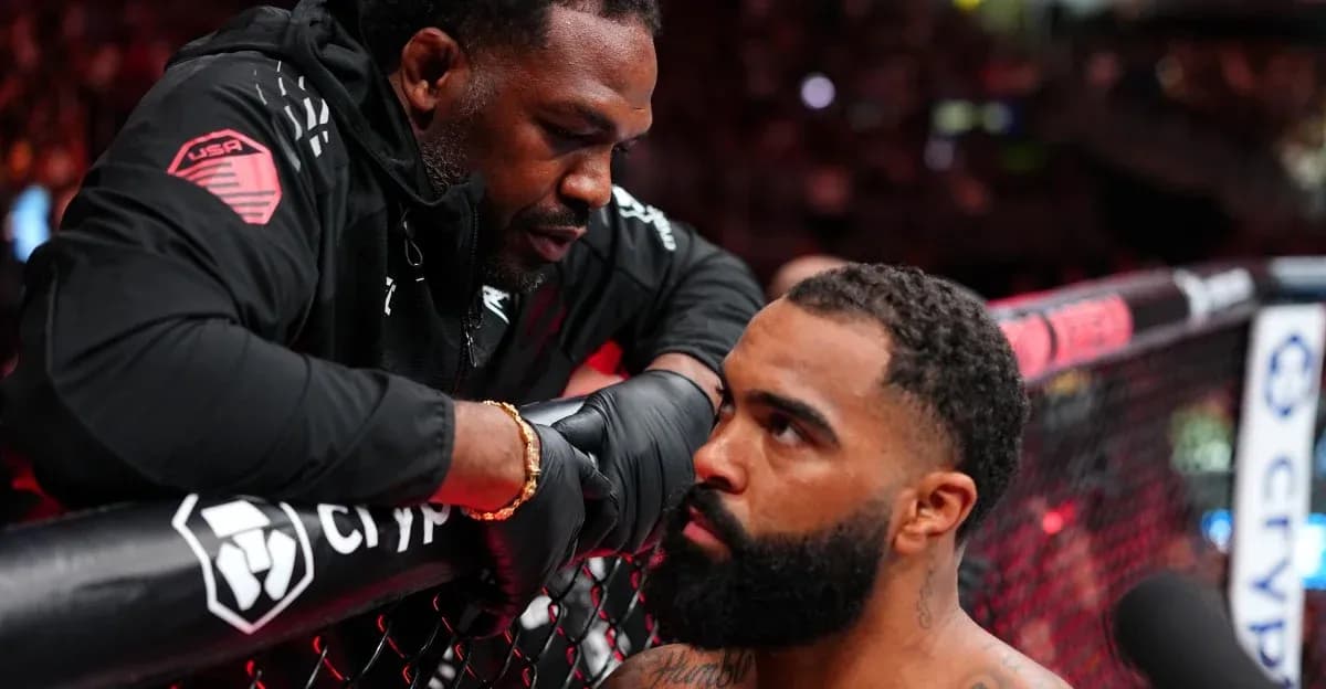 Coach advising fighter in the octagon corner