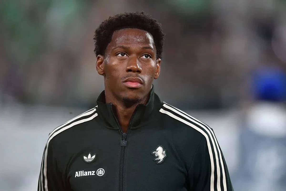 Player in black jacket on the pitch