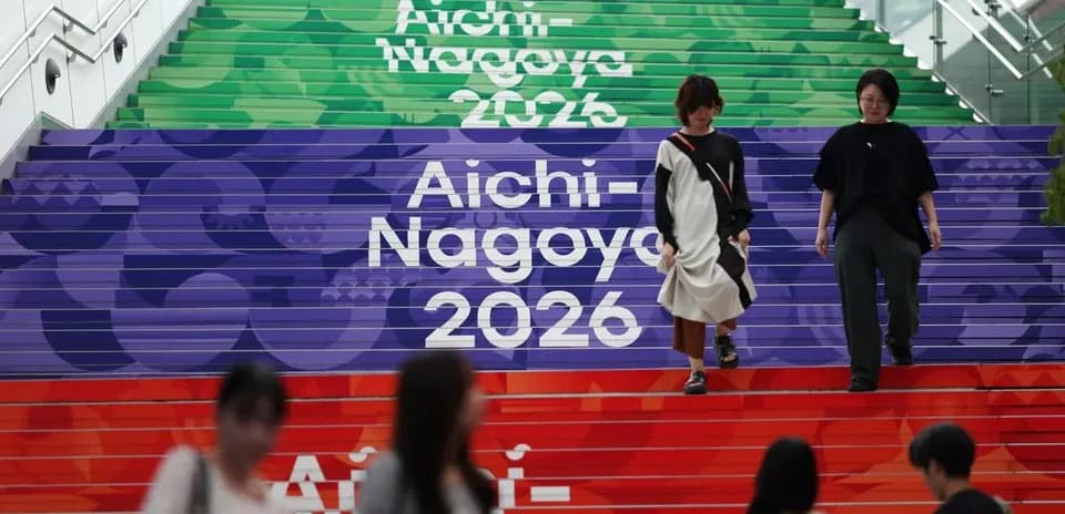 People walking down colorful steps with Aichi-Nagoya 2026