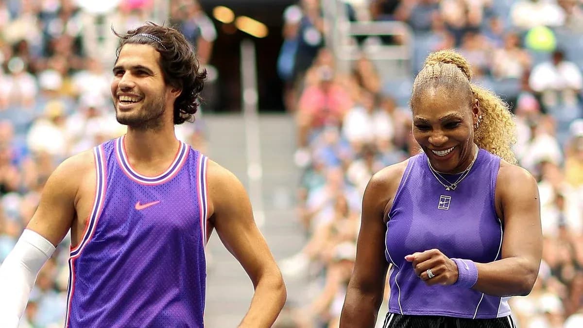 Two tennis players smiling on court after match