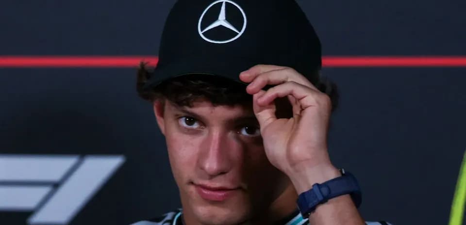 Young man wearing a Mercedes cap at event