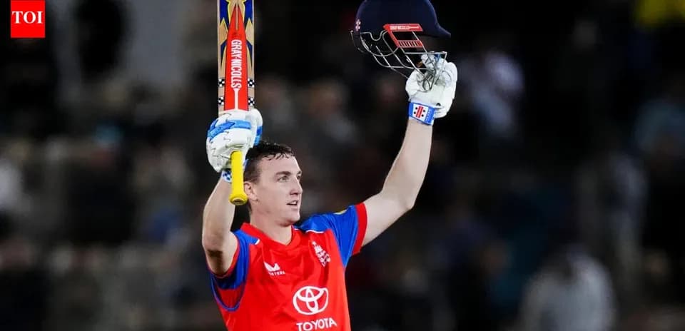Cricketer celebrating with bat and helmet raised