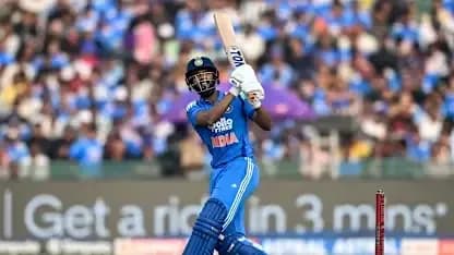 Batsman playing a shot during cricket match
