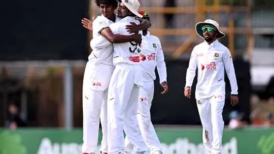 Players celebrating after a wicket during match