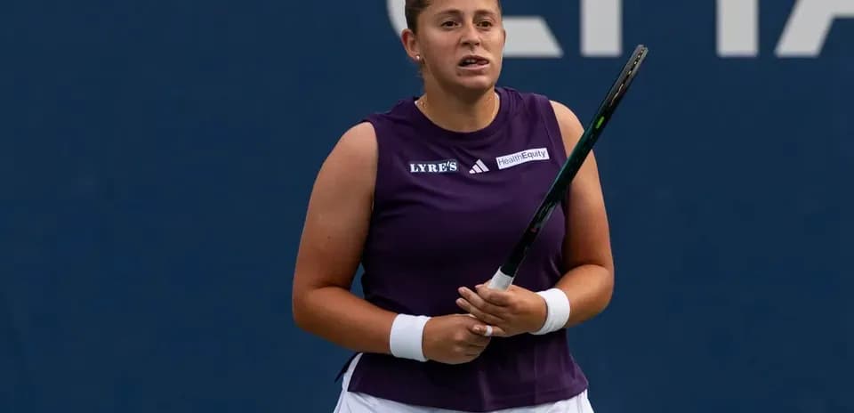 Tennis player holding racket during match