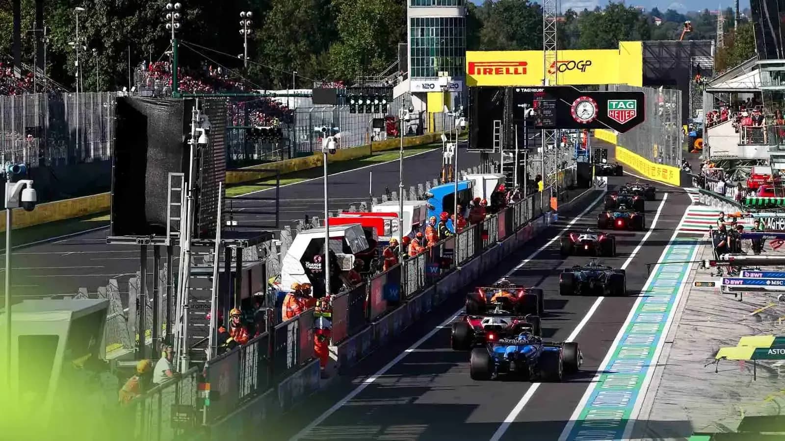 Formula 1 cars in the pit lane during race