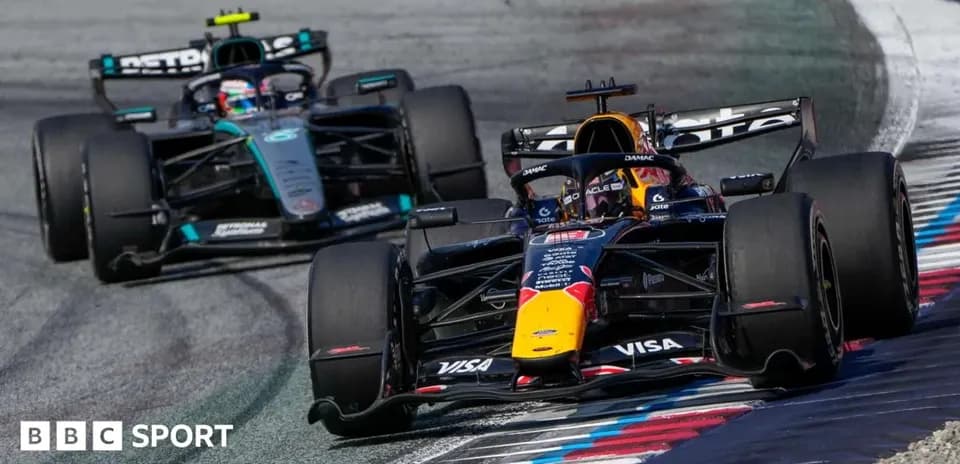 Red Bull and Mercedes cars racing on track