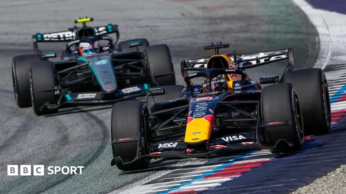 Red Bull and Mercedes cars racing on track