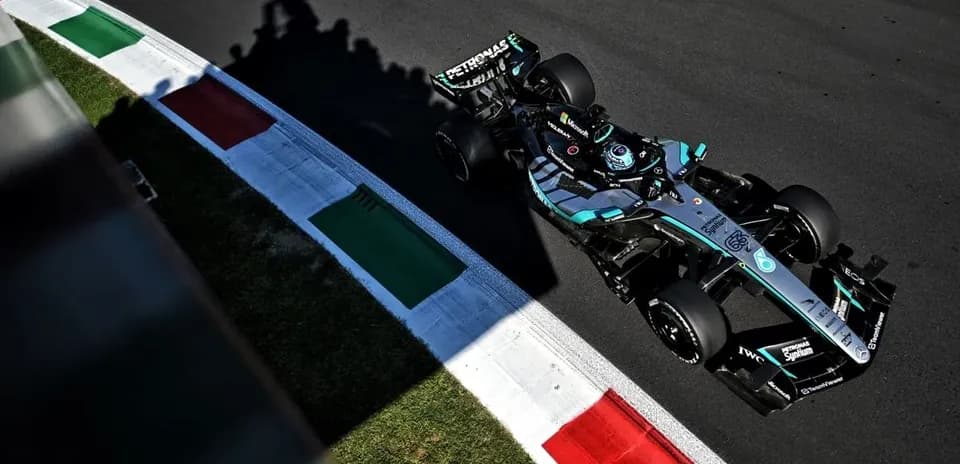 Formula 1 car navigating track with Italian flag colors