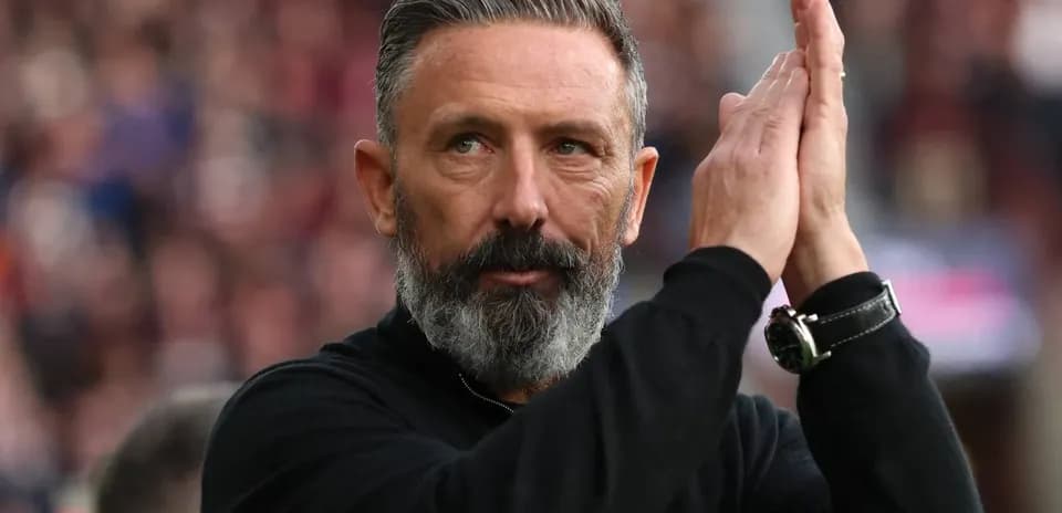 Coach applauding during a match in stadium