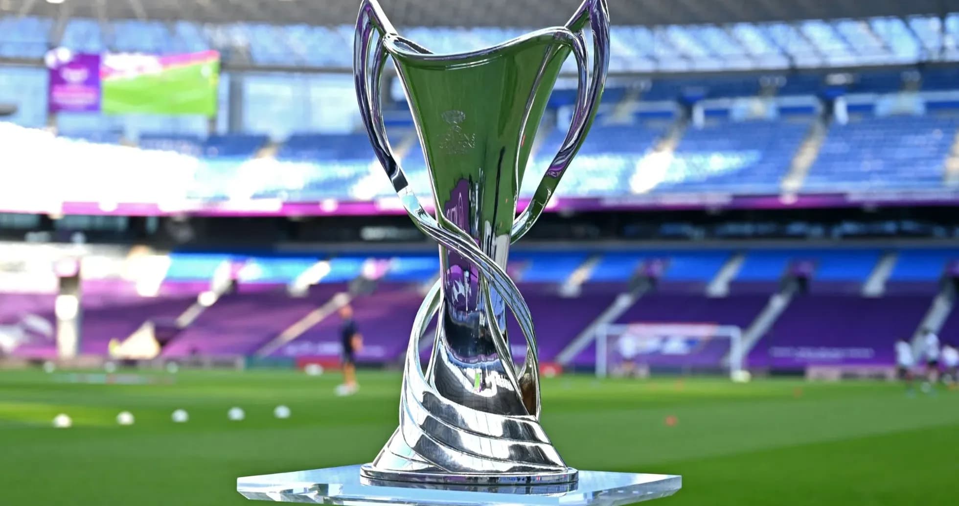 Shiny trophy displayed on the pitch before match