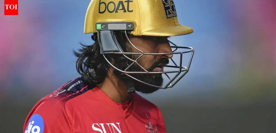 Cricketer wearing a gold helmet during match