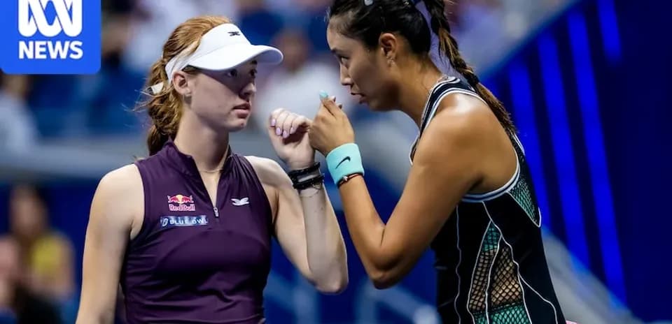 Two tennis players discussing strategy during match
