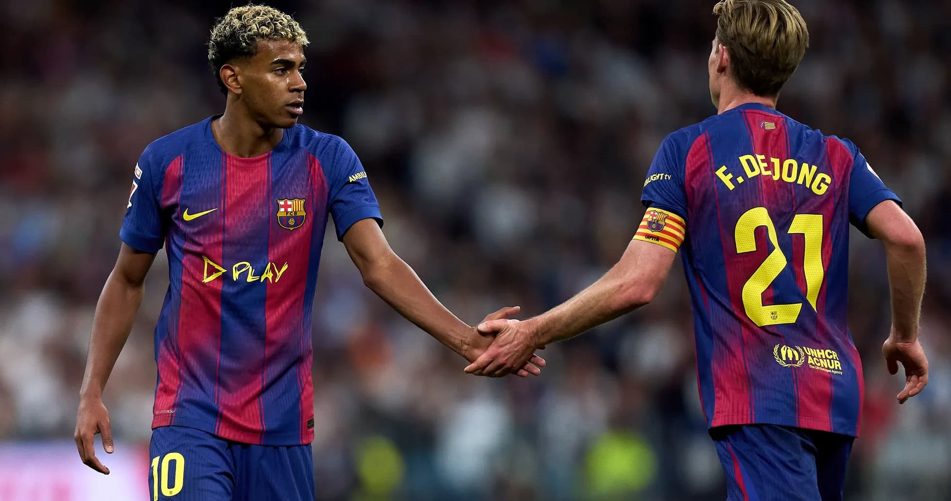 Barcelona players exchanging handshakes on the pitch