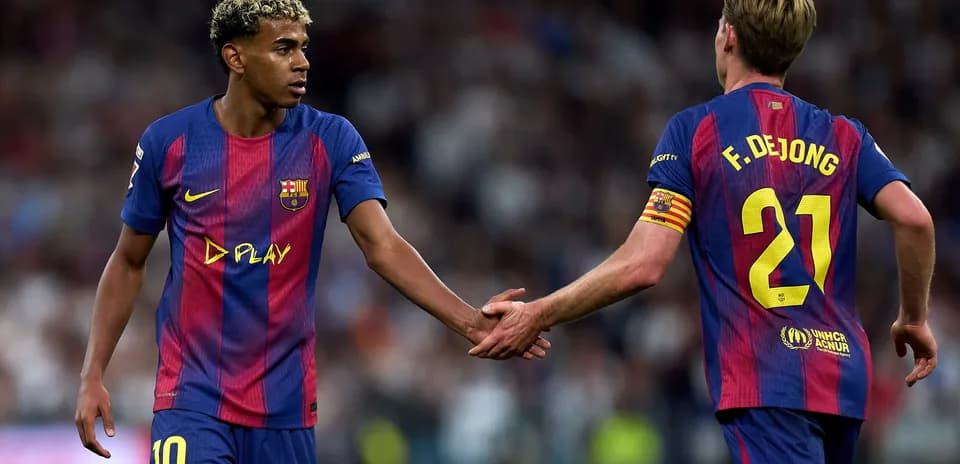 Barcelona players exchanging handshakes on the pitch