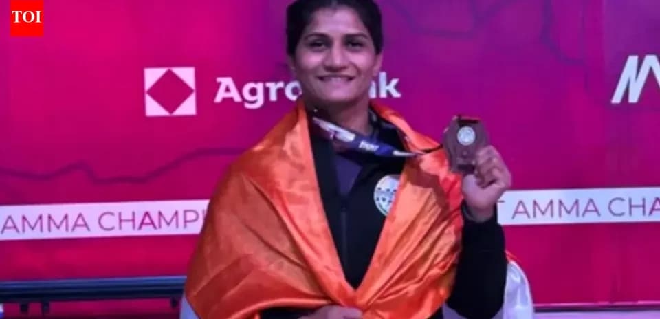 Athlete celebrating with medal and flag at championship