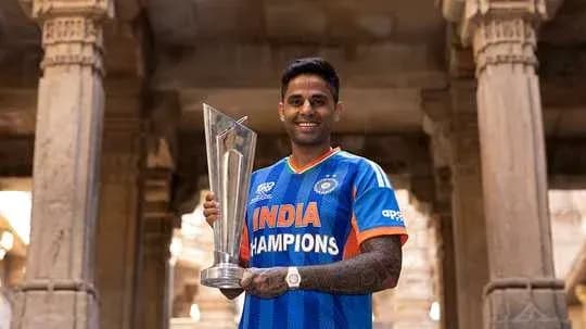 Player holding trophy in Indian team jersey