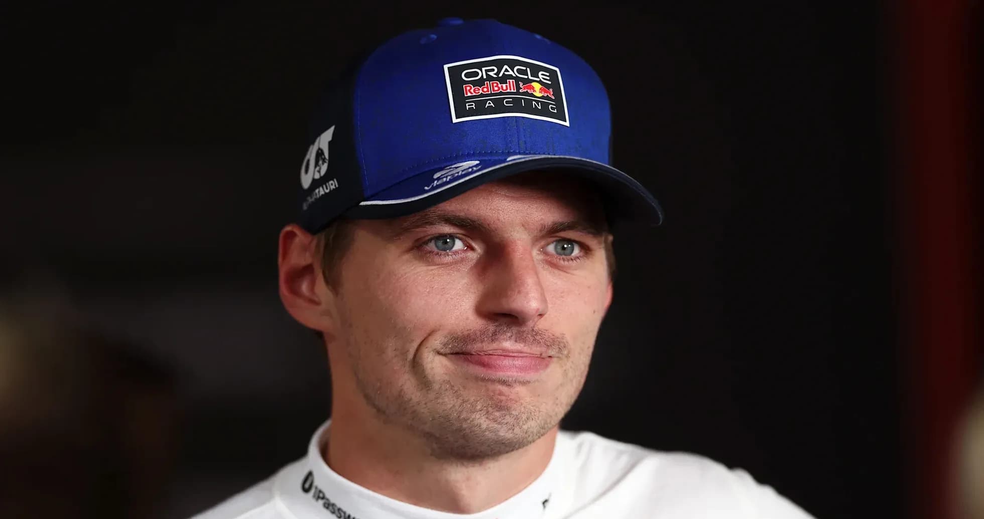 Racing driver wearing a blue cap during interview