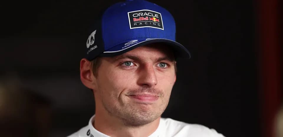 Racing driver wearing a blue cap during interview
