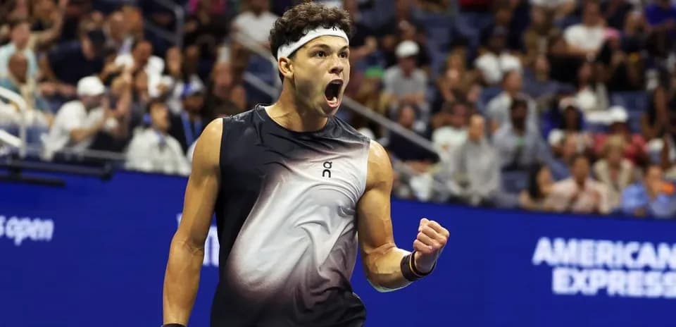 Tennis player celebrating a point during match