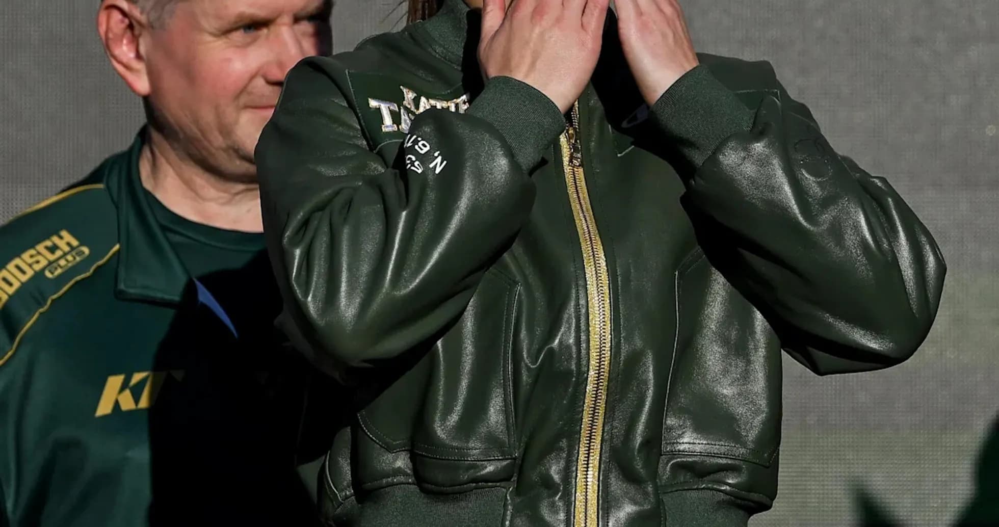 Female athlete blowing kisses at weigh-in event