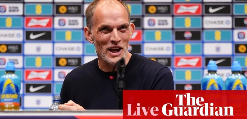 Manager speaking at press conference with backdrop